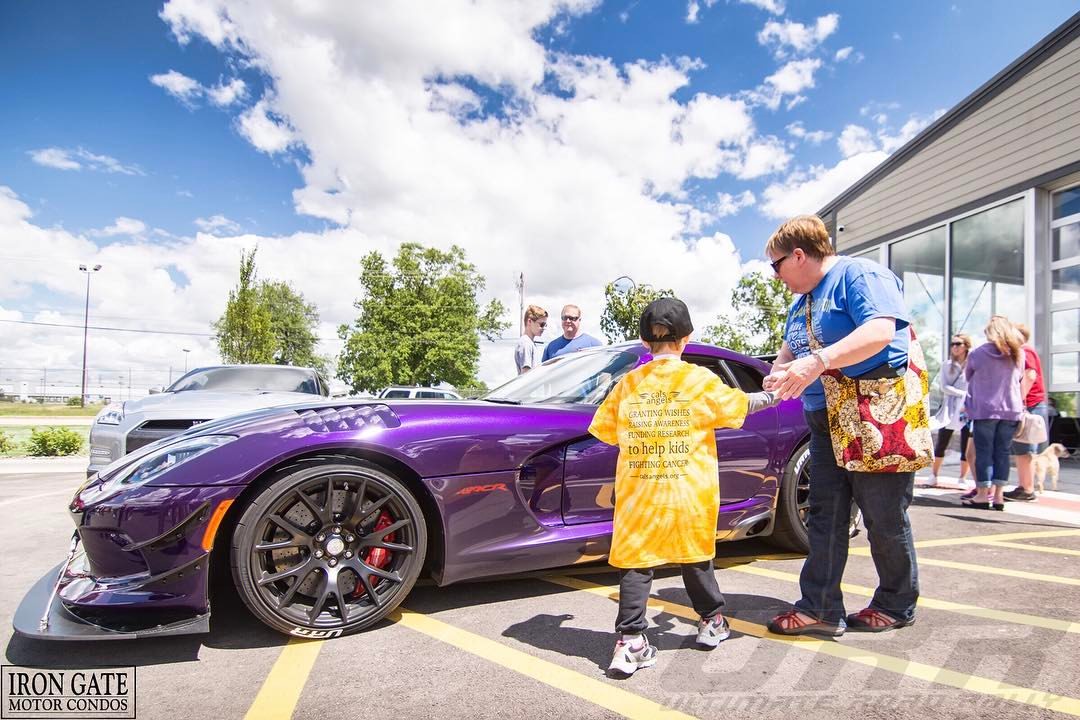 A Cal's kid admires the ACR Dodge Viper owned by URR event organizer Omar Salaymeh