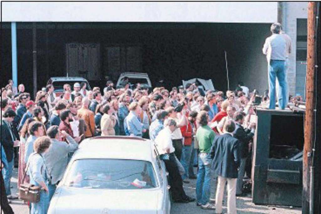 The start of the 1979 Cannonball from behind the Lock, Stock and Barrel Pub in Darien CT. Brock Yates addresses the participants from atop the dumpster